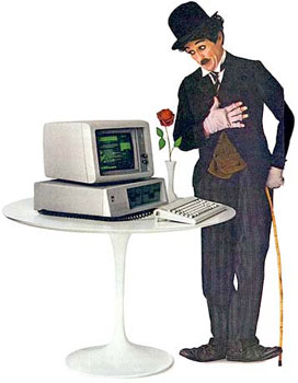 Charlie Chaplin standing next to an IBM PC