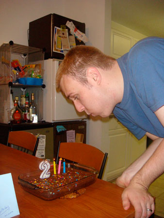 Russell blowing out the candles on his 23rd birthday.