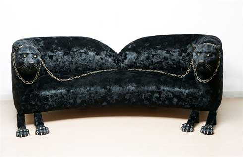 A sofa with Panther heads.