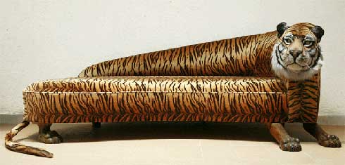 A sofa with a Tiger head on it.